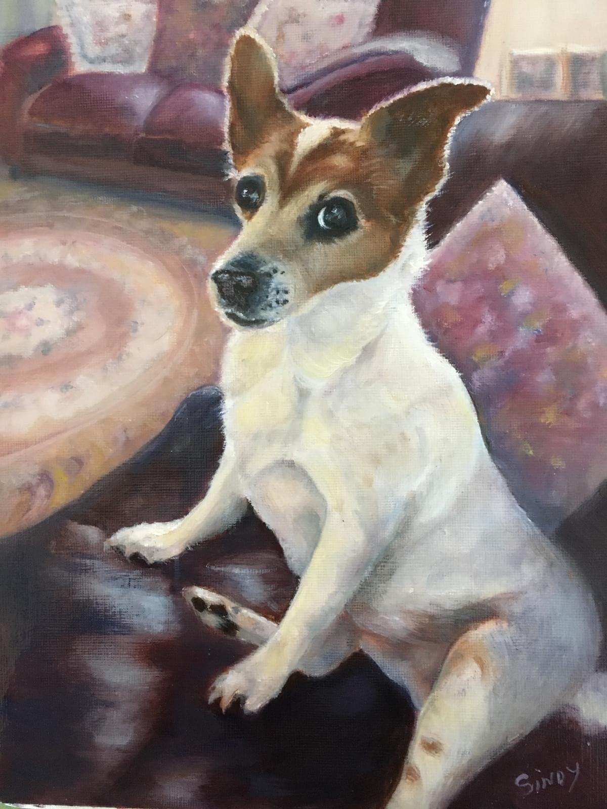 Oil painting of a Jack Russell terrier sitting up in a cosy room with a sofa and rug behind