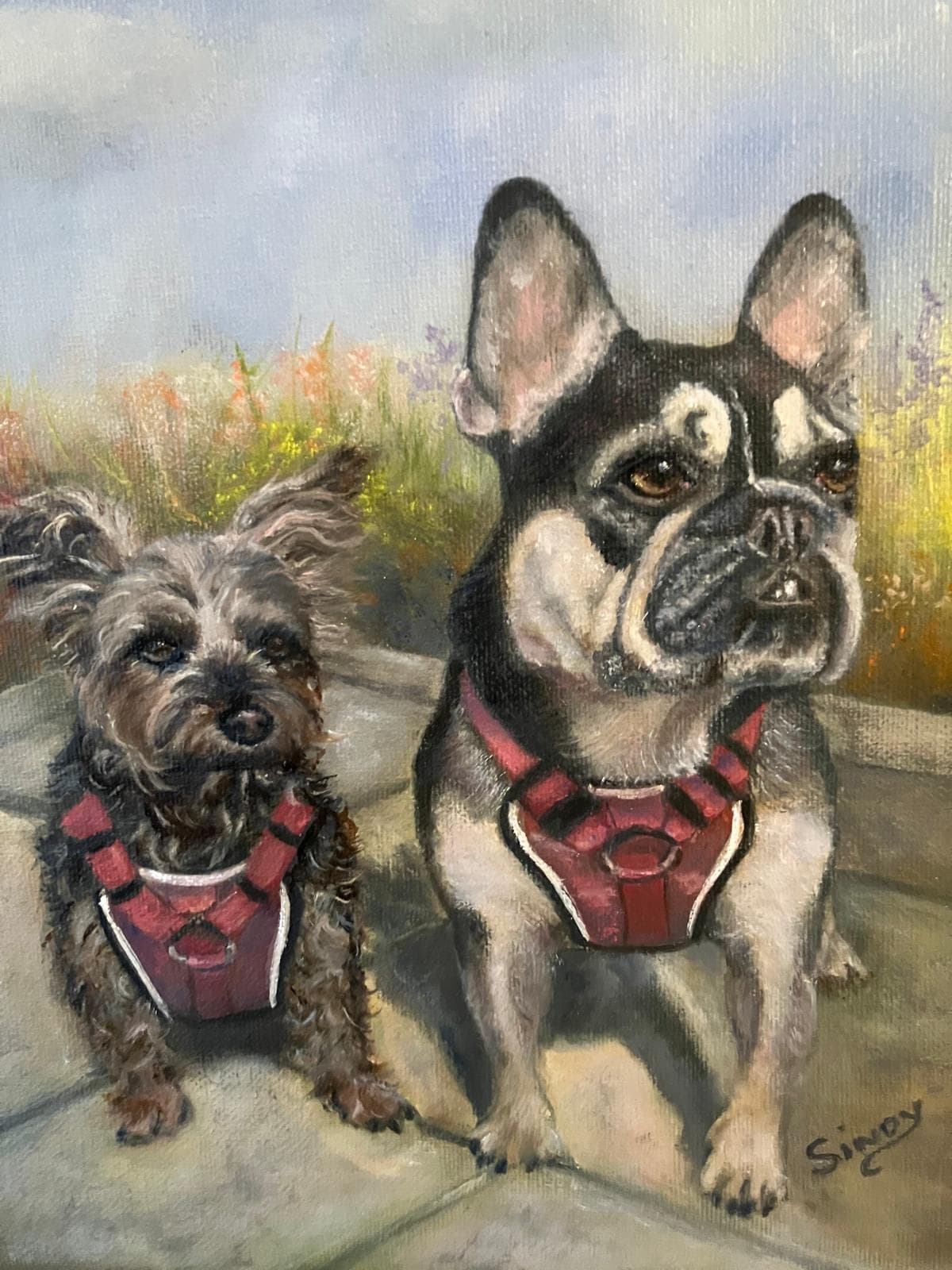 Oil painting of Nellie the French bulldog and Millie the Yorkshire terrier in matching red harnesses